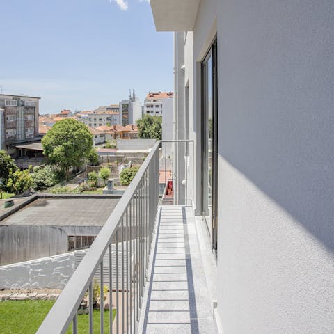 Sip your morning coffee on the private balcony while taking in views over Porto's rooftops