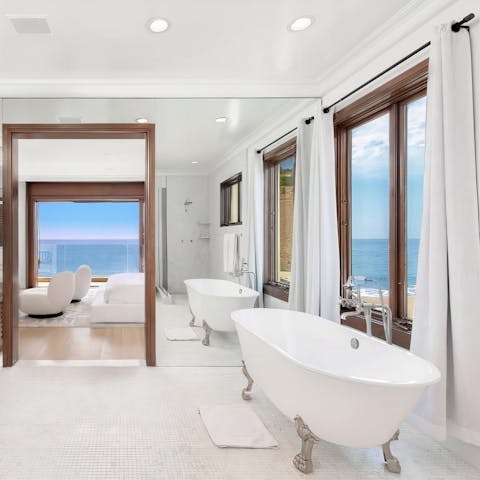 Treat yourself to an indulgent bath with a view as you soak in this freestanding tub