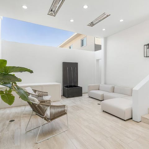 Blur the lines between outside and in as you sit in this partially covered room