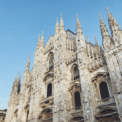 Visit the iconic Duomo di Milano, a short walk away