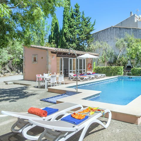 Dry off on a lounger after splashing about in the private pool