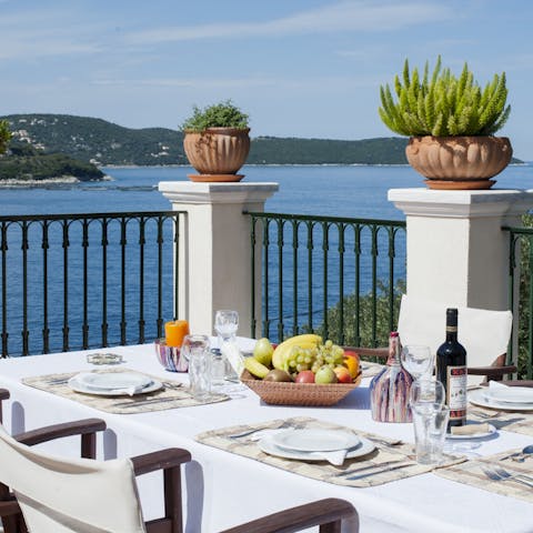 Enjoy an authentic Greek meal prepared by a private chef at the alfresco dining area