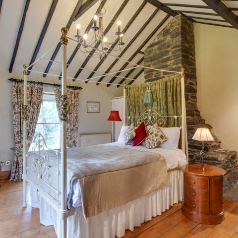 Fall asleep underneath characterful wooden beams in the original four-poster bed