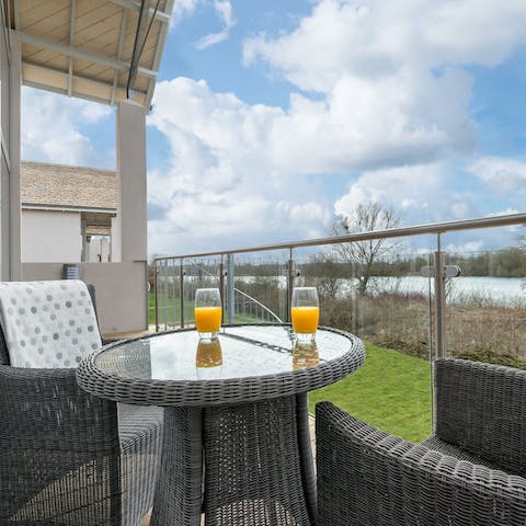 Sip a cup of tea or fresh juice on the balcony overlooking the lake