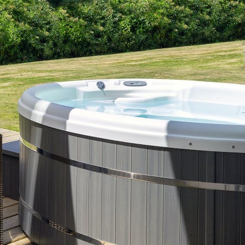 Lower yourself into the steaming bubbles of the hot tub