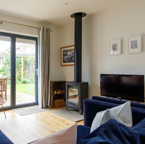 Snuggle up by the wood burner after a day exploring the coast
