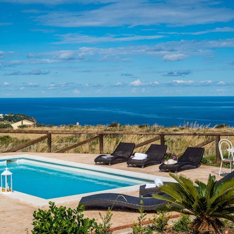 Sun yourself by the pool with stunning ocean views