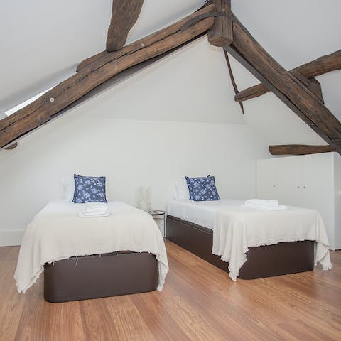 Enjoy a great slumber under the wooden beams in the bedroom