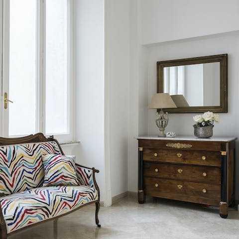 Find a relaxing reading spot on the elegant antique furniture