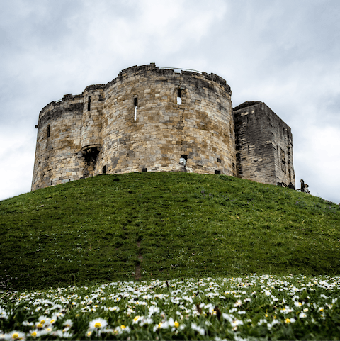 Hop over the river to Clifford's Tower, just a nine-minute walk from your door