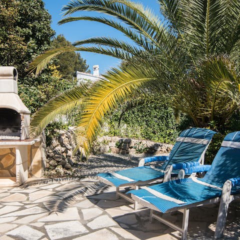 Enjoy an afternoon snooze in the dapped shade of the palms