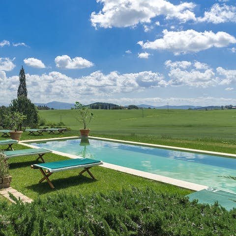Float serenely in the swimming pool overlooking the fields