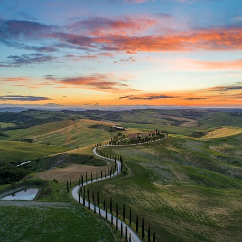 Stay in the Tuscan countryside, a land of rolling hills and vineyards