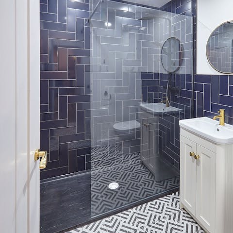 Treat yourself to a long soak under the bathroom's rainfall shower
