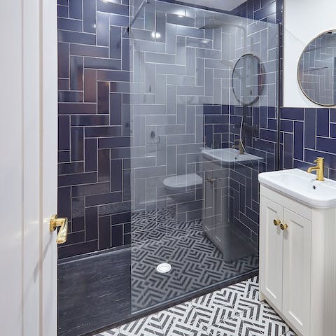 Treat yourself to a long soak under the bathroom's rainfall shower