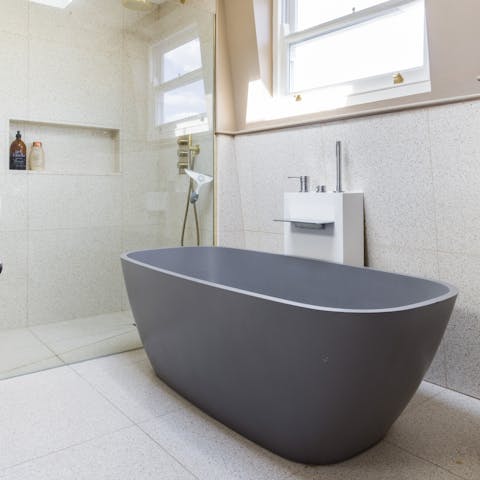 Practice self-care and enjoy a bubble bath in the free-standing tub