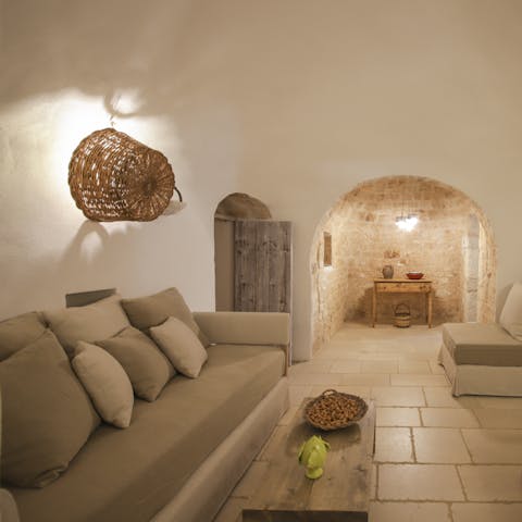 Soak up the charm of a cavernous trullo with a glass of Italian wine in hand