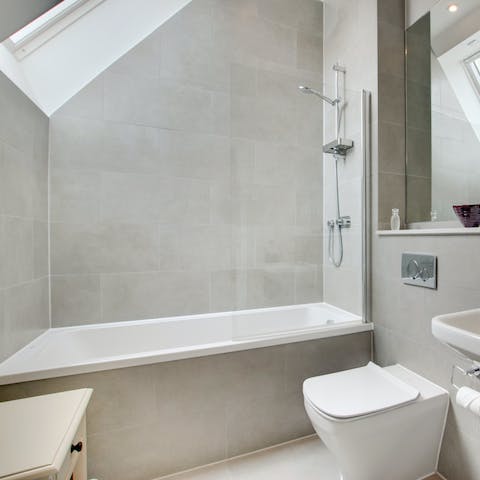 Treat yourself to a soak and watch the clouds through skylight