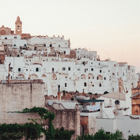 Drive minutes to Ostuni to explore the whitewashed town