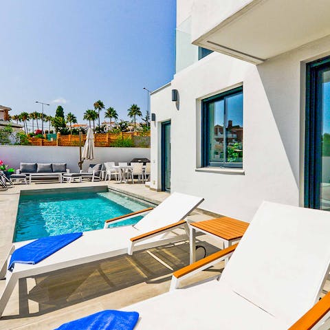 Catch plenty of sun by the pool, cocktail in hand
