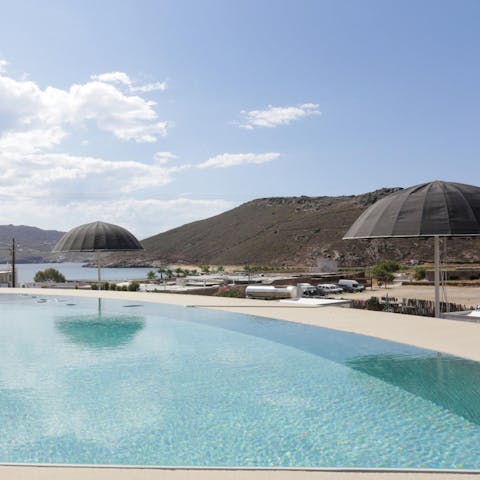 Enjoy swimming with views across Panormos Bay