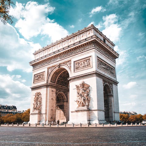 Gaze up at the iconic Arc de Triomphe, just a five-minute walk away
