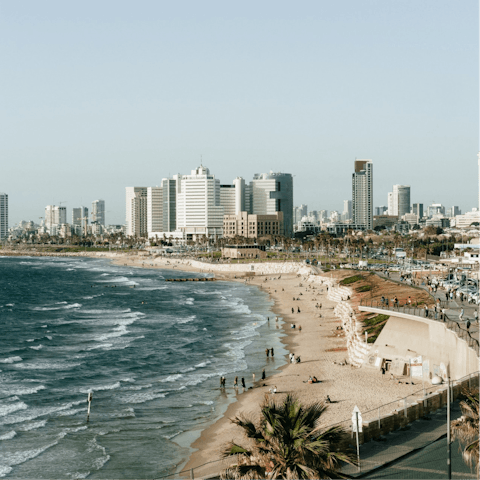 Catch a bus down to the sandy expanse of Tel Aviv Beach