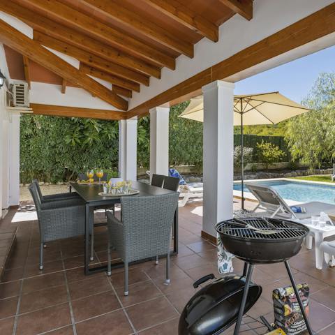 Cook up some Spanish sausages on your barbecue and eat on your shaded patio