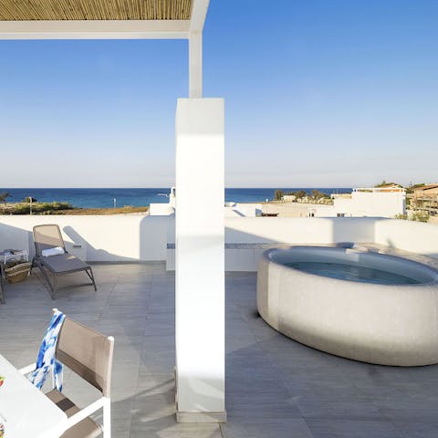 Marvel at jaw-dropping Mediterranean vistas from the rooftop hot tub