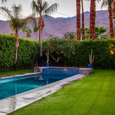 Take a dip in the swimming pool with mountain views