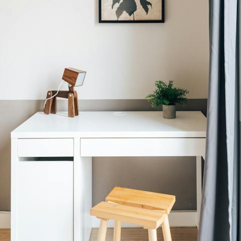 Catch up on work at the bedroom's desk space