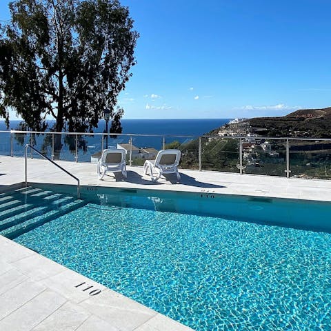 Admire the Mediterranean Sea views from the shared pool