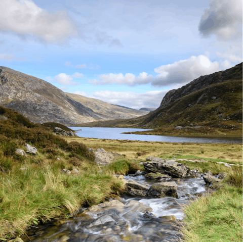 Explore the natural beauty of Snowdonia National Park, a twenty-minute drive away