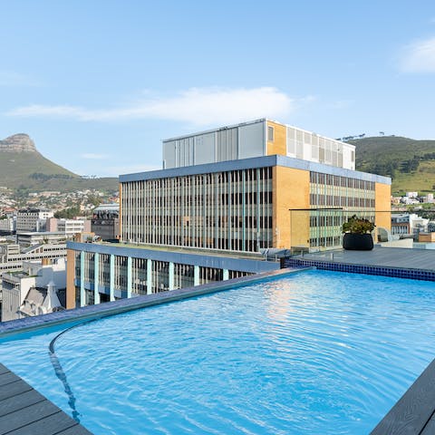 Admire panoramic city views from the communal rooftop pool