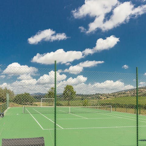 Enjoy a game of doubles on the tennis court after lunch