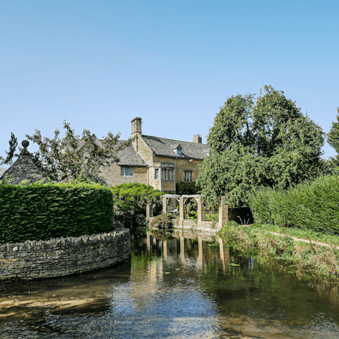 Visit the pretty village of Bourton-on-the-Water, a twenty-minute drive away