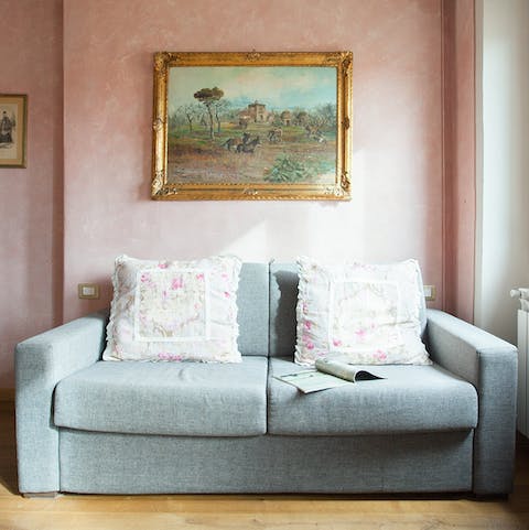 Unwind with a glass of Italy's best wine in the soft pink living room