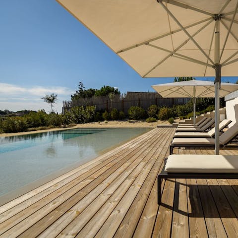 Spend dreamy days lounging by the pool or walk to the beach