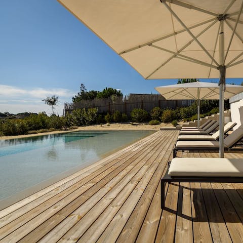 Spend dreamy days lounging by the pool or walk to the beach