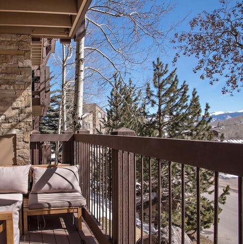 Watching skiers scale the slopes from the balcony