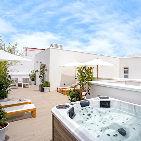 Unwind on the private roof terrace where the jacuzzi invites refreshing dips