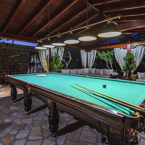 Get competitive at Russian Billiards 