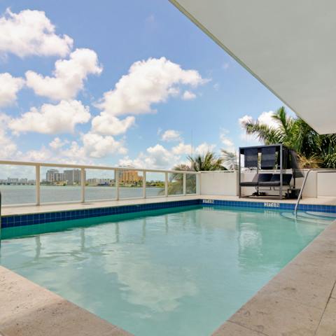 Go for a dip in the shared pool with ocean views