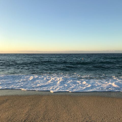 Spend warm afternoons stretched out on Porticcio Beach, a short drive away