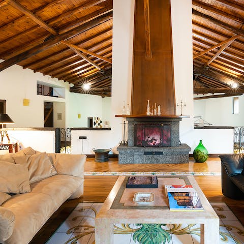 Relax on the plush sofas beside the crackling fireplace in the colder months