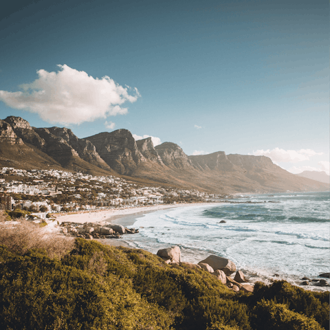 Stay in the beachside suburb of Camps Bay and stroll the sand, a four-minute drive away