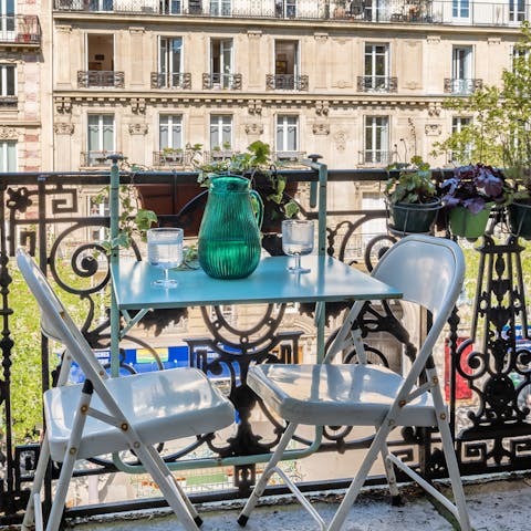 Unwind after a long day of sightseeing by enjoying wine on the balcony