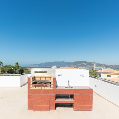 Head up to the rooftop terrace to the outdoor kitchen with a stunning view