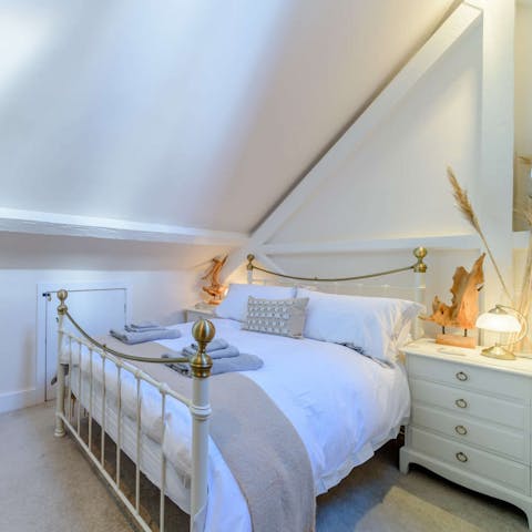 Sleep soundly beneath the eaves in your comfortable bedroom