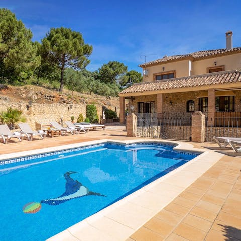 Take a plunge in the private pool with views of the Andalusian hills